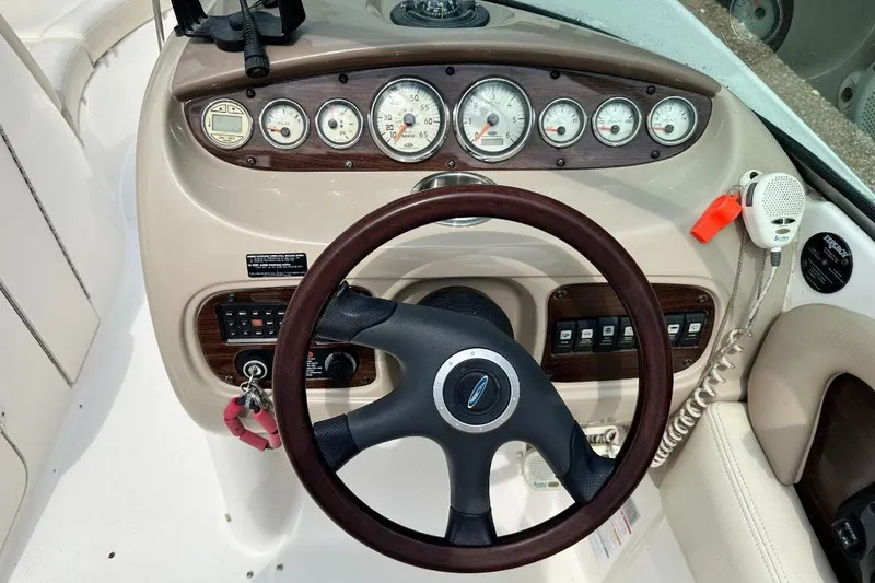 Slide: The Image of Steering wheel and dashboard of a 2005 Chaparral Sunesta 274 boat. - 10
