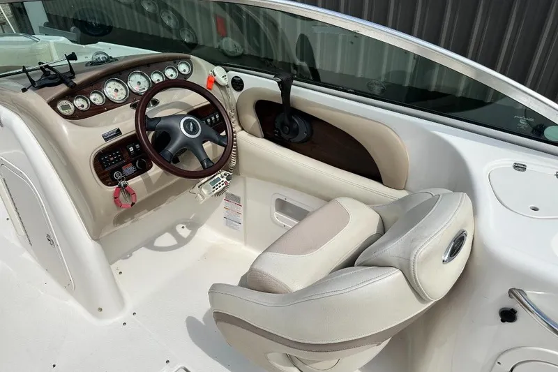 Slide: The Image of 2005 Chaparral Sunesta 274 boat cockpit with steering wheel and instrument panel. - 9