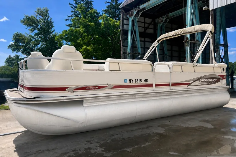 Slide: The Image of 2006 Princecraft Versailles 22 LP-SS pontoon boat docked outdoors. - 1