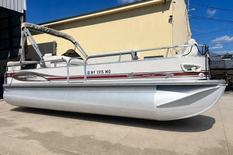 The Image of 2006 Princecraft Versailles 22 LP-SS pontoon boat parked outdoors on a sunny day. - 0