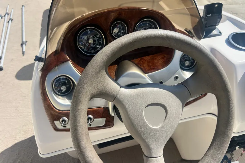 Slide: The Image of 2006 Princecraft Versailles 22 LP-SS dashboard with steering wheel and gauges. - 5