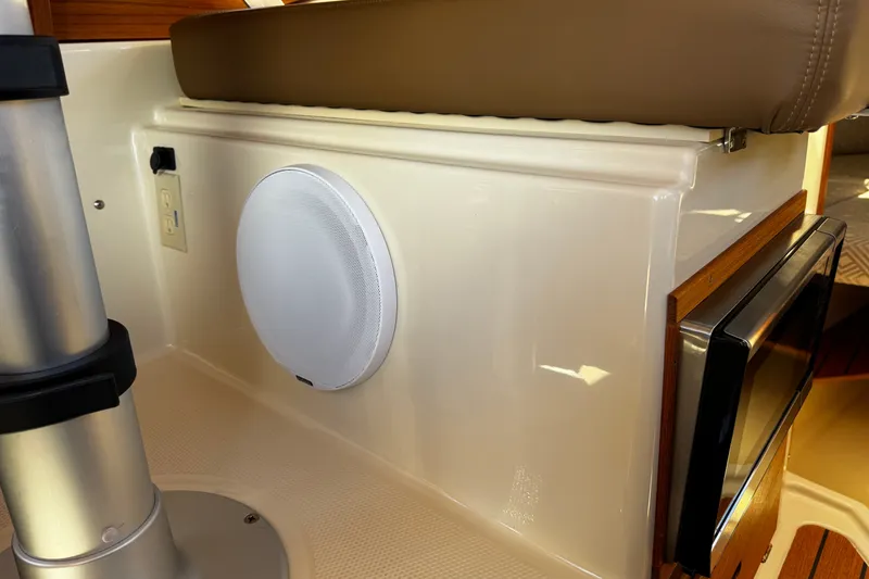 Slide: The Image of Interior of 2020 Ranger Tugs R-23 boat with speaker and microwave. - 11