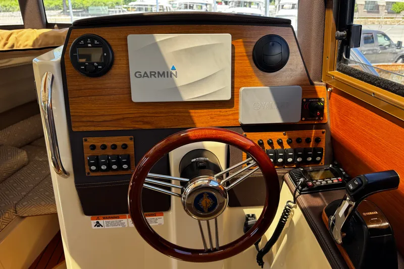 Slide: The Image of Cockpit of 2020 Ranger Tugs R-23 with Garmin navigation system and Yamaha controls. - 5