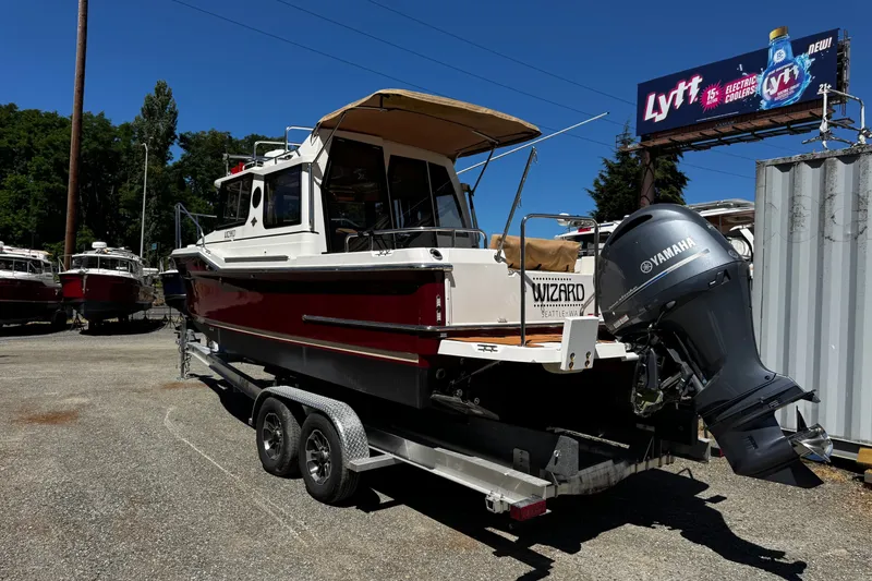 Slide: The Image of 2020 Ranger Tugs R-23 boat on trailer with Yamaha outboard motor. - 2