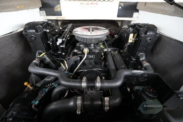 The Image of Engine compartment of a 2006 Sea Ray 205 Sport boat, showcasing detailed mechanical components. - 2