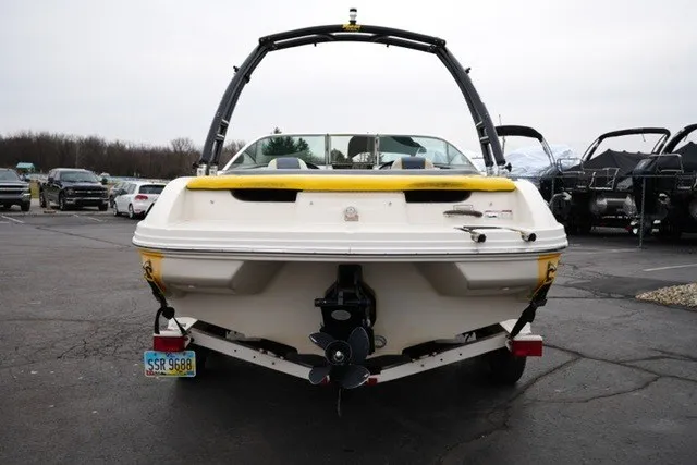 Slide: The Image of 2006 Sea Ray 205 Sport boat, rear view, parked on a trailer in a lot. - 10