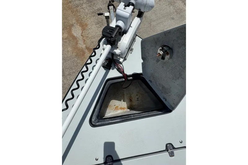 Slide: The Image of 2018 Blazer Bay 2420 GTS boat with open storage compartment and mounted equipment. - 20