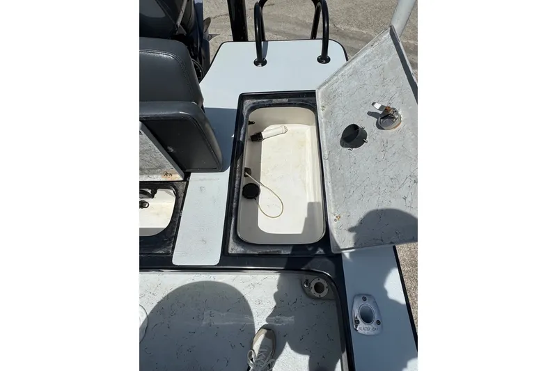 Slide: The Image of 2018 Blazer Bay 2420 GTS boat interior with open storage compartment and seating. - 14