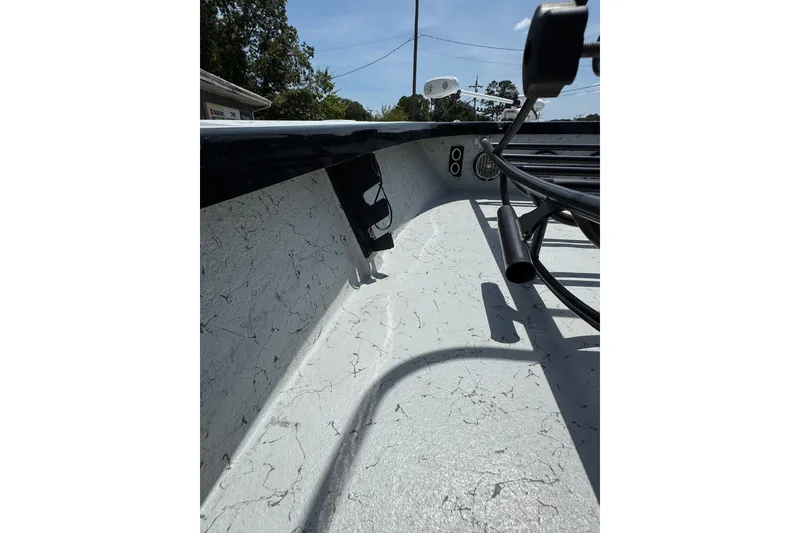 Slide: The Image of 2018 Blazer Bay 2420 GTS boat interior with textured flooring and rod holders. - 21