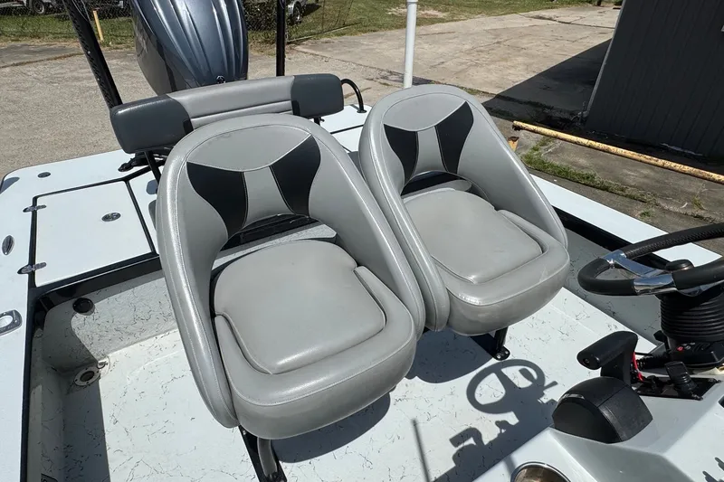 Slide: The Image of 2018 Blazer Bay 2420 GTS boat with dual gray seats and steering console. - 15