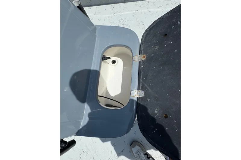 Slide: The Image of Open storage compartment on a 2018 Blazer Bay 2420 GTS boat, showing interior details. - 17