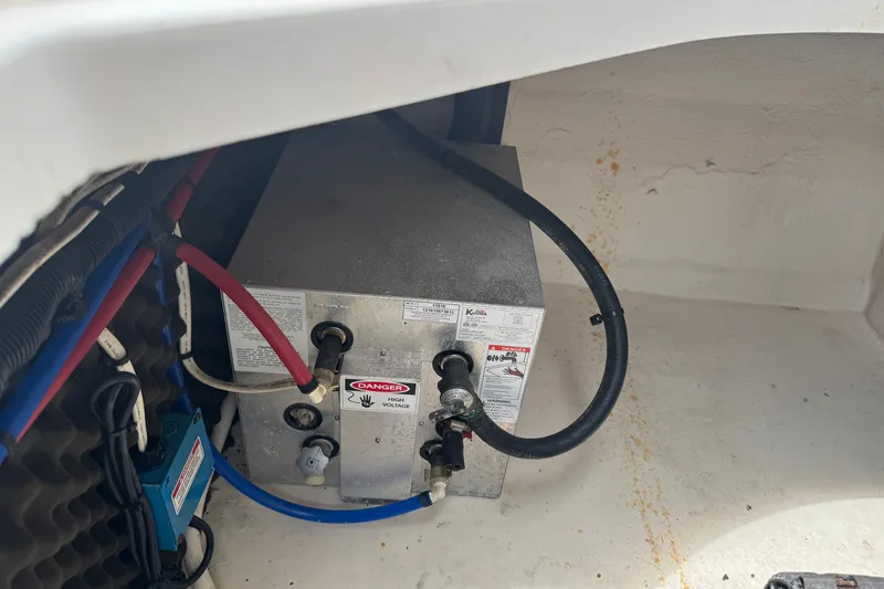 Slide: The Image of 2006 Sea Ray Sundancer 260 engine compartment with electrical components and wiring. - 13
