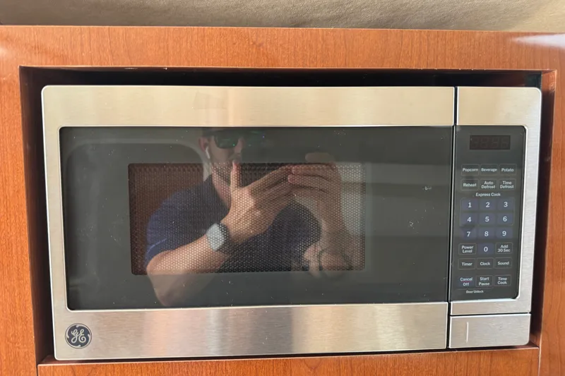 Slide: The Image of GE microwave in a 2006 Sea Ray Sundancer 260 yacht kitchen. - 19