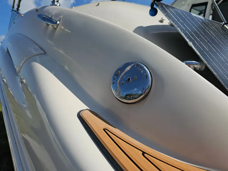Slide: The Image of Close-up of a 2006 Sea Ray 270 Sundeck with shiny logo and wood details. - 41