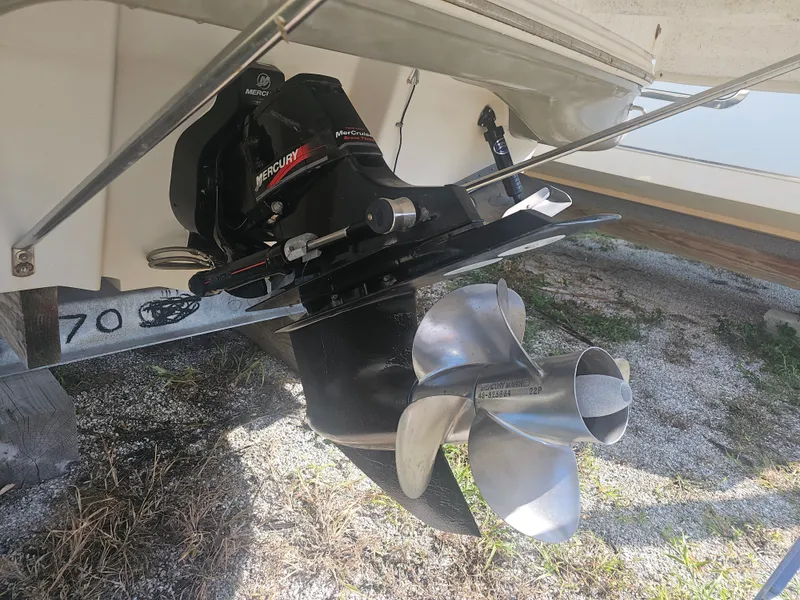 Slide: The Image of A Mercury drive with a stainless steel dual propeller setup is mounted at the boat's stern. - 14