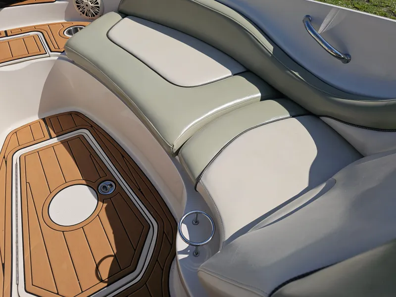 Slide: The Image of The image shows the elegant cockpit of a Sea Ray 270 Sundeck with comfortable seating and teak flooring. - 31