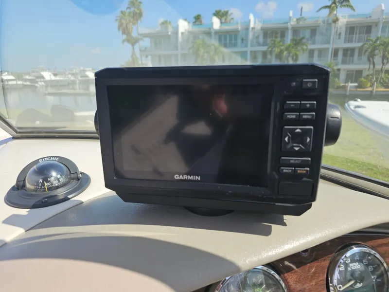 Slide: The Image of A Garmin navigation system is mounted on the dashboard of a 2006 Sea Ray 270 Sundeck. - 16