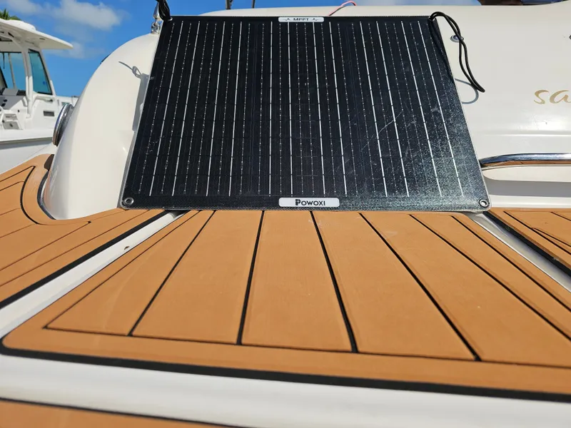 Slide: The Image of A solar panel is mounted on the deck of a 2006 Sea Ray 270 Sundeck boat. - 40