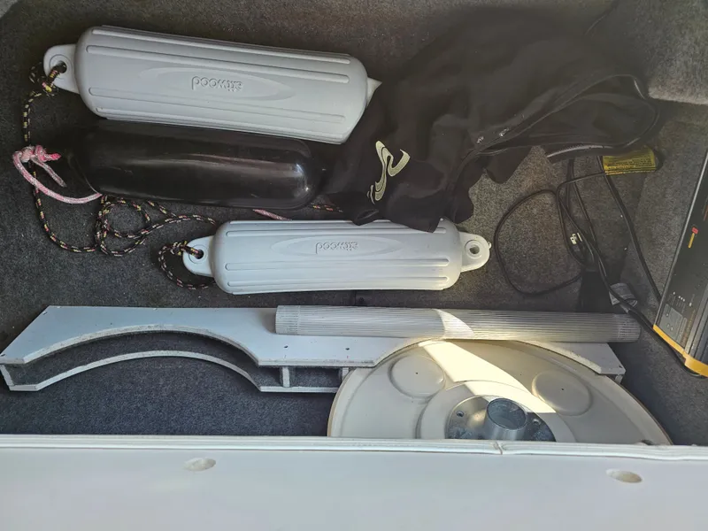 Slide: The Image of Storage compartment with fenders and accessories on a 2006 Sea Ray 270 Sundeck. - 24