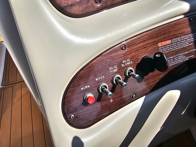 Slide: The Image of Close-up of the control panel with switches for horn, wiper, bilge pump, and blower. - 35