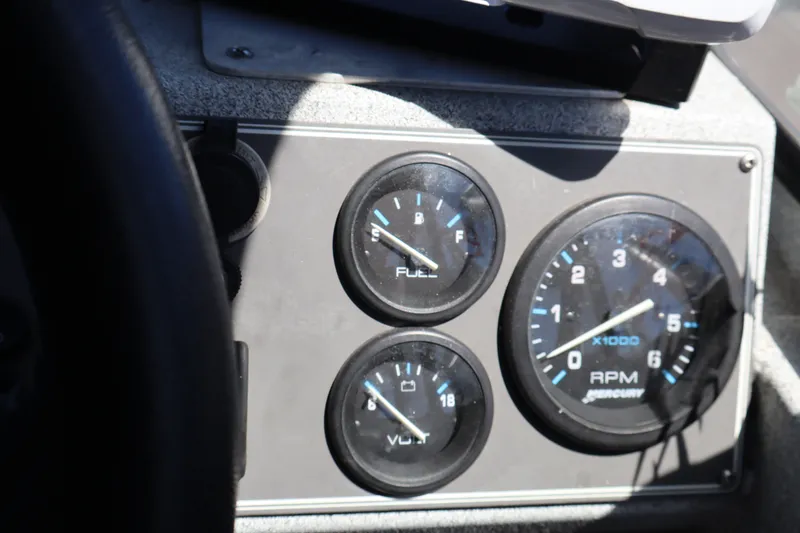Slide: The Image of Dashboard of a 2005 Jetcraft 1625 SK showing fuel, voltage, and RPM gauges. - 15