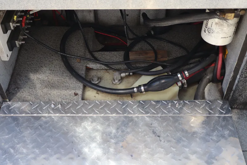 Slide: The Image of 2005 Jetcraft 1625 SK interior wiring and fuel system components. - 10