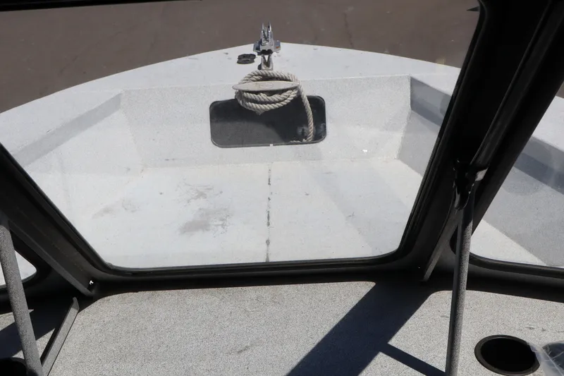 Slide: The Image of Interior view of a 2005 Jetcraft 1625 SK boat, featuring a rope on the deck. - 16