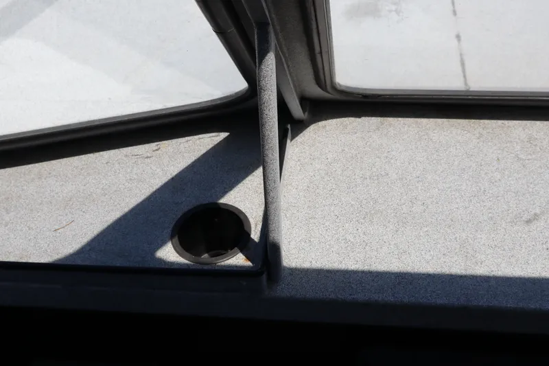 Slide: The Image of Interior view of a 2005 Jetcraft 1625 SK boat with a cup holder. - 17