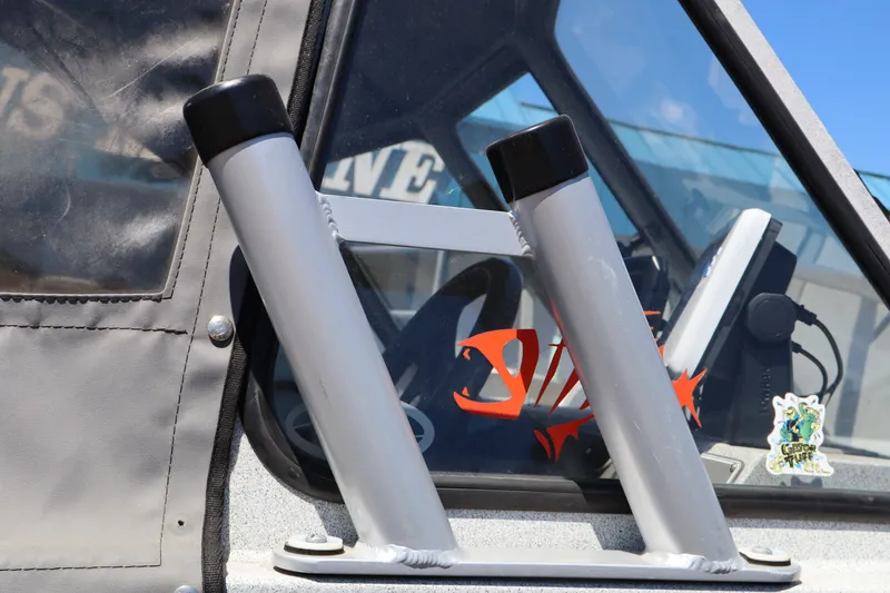 Slide: The Image of Close-up of a 2005 Jetcraft 1625 SK boat with rod holders and decals. - 19