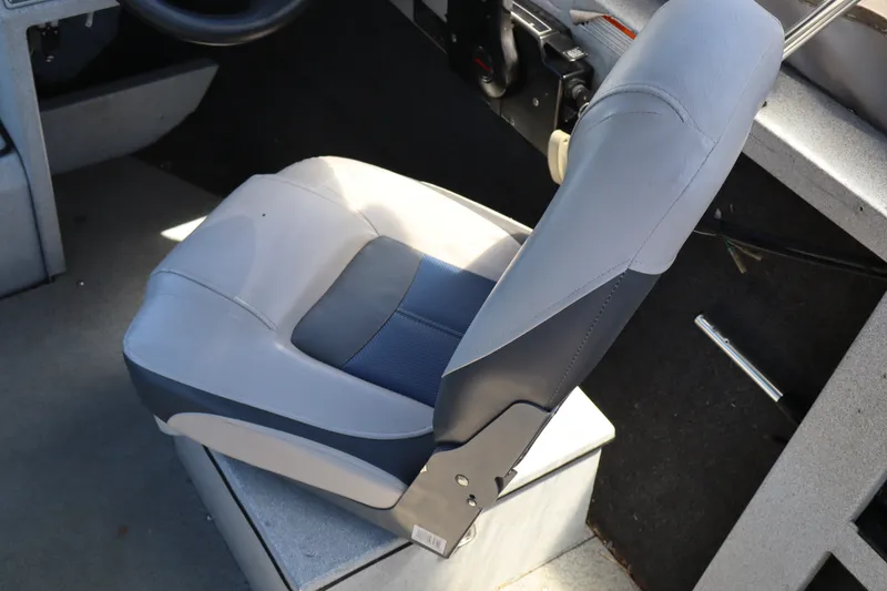 Slide: The Image of Boat seat in a 2005 Jetcraft 1625 SK, featuring gray and blue upholstery. - 11