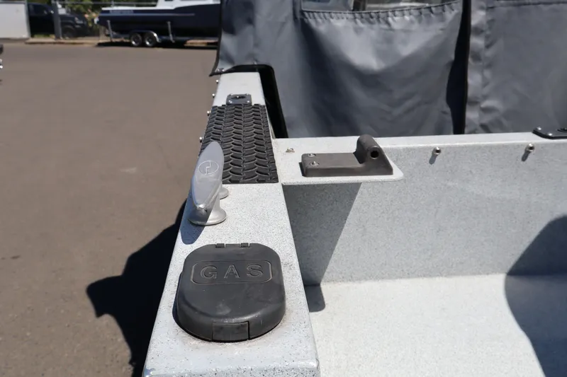 Slide: The Image of 2005 Jetcraft 1625 SK boat showing gas cap and deck details. - 8