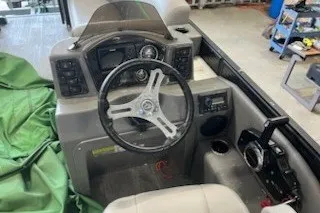 Slide: The Image of 2022 Angler Qwest 820XRE Cruise LT boat dashboard with steering wheel and controls. - 8