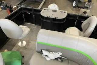 Slide: The Image of 2022 Angler Qwest 820XRE Cruise LT interior with seating and control console. - 27