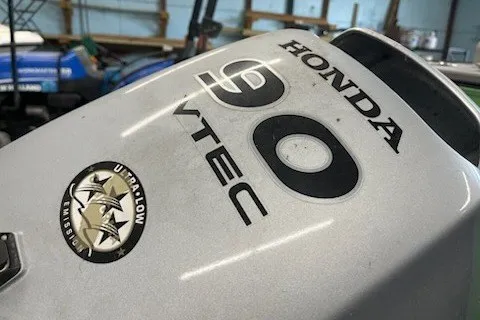 Slide: The Image of Honda 90 VTEC outboard motor on 2022 Angler Qwest 820XRE Cruise LT boat. - 2