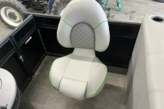 Slide: The Image of 2022 Angler Qwest 820XRE Cruise LT boat seat with gray upholstery and green accents. - 21