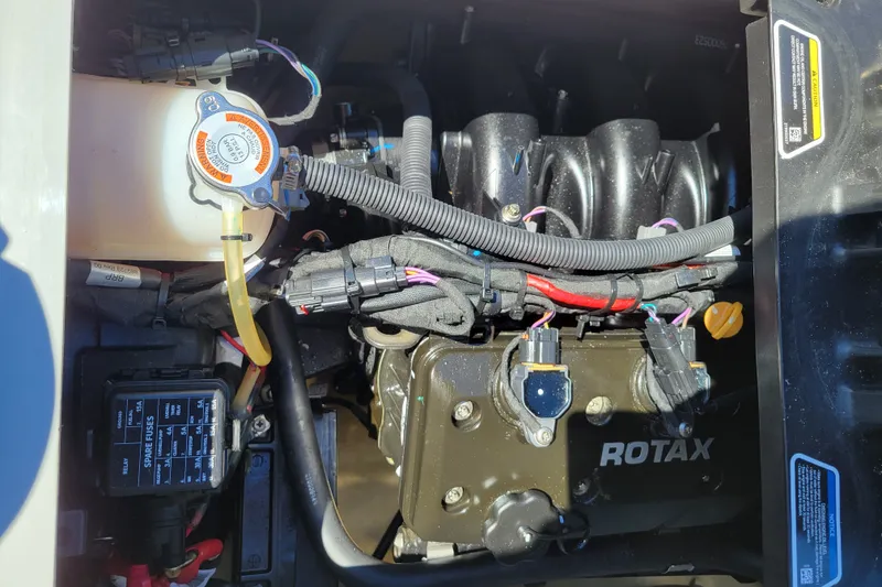 Slide: The Image of Engine compartment of 2022 Sea-Doo FishPro Trophy 170 with Rotax engine components. - 20