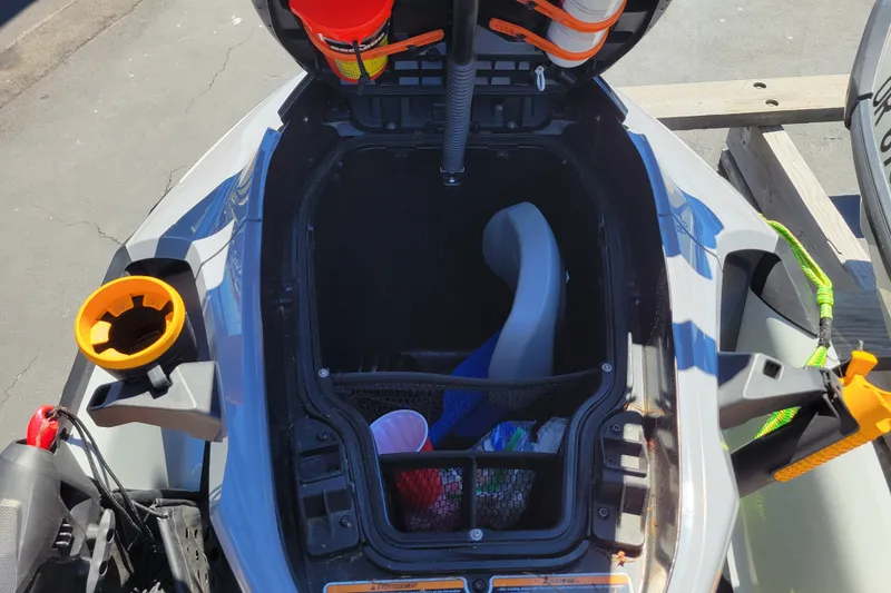 Slide: The Image of 2022 Sea-Doo FishPro Trophy 170 storage compartment with fishing gear and accessories. - 19