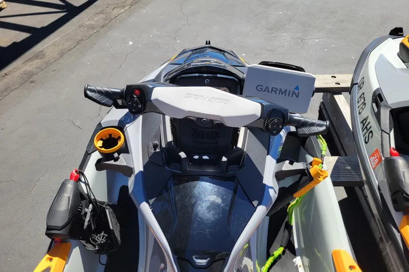 Slide: The Image of 2022 Sea-Doo FishPro Trophy 170 with Garmin navigation system, parked on pavement. - 14