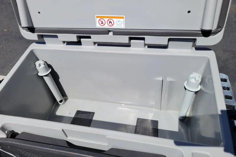 Slide: The Image of Open storage compartment of 2022 Sea-Doo FishPro Trophy 170, featuring rod holders. - 22