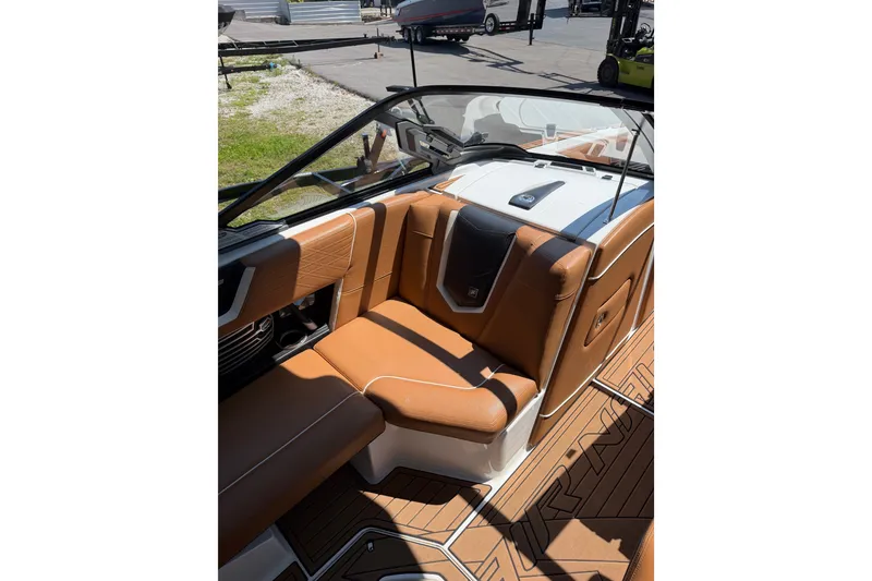 Slide: The Image of 2019 Nautique Super Air Nautique G25 interior with tan leather seating and sleek design. - 18