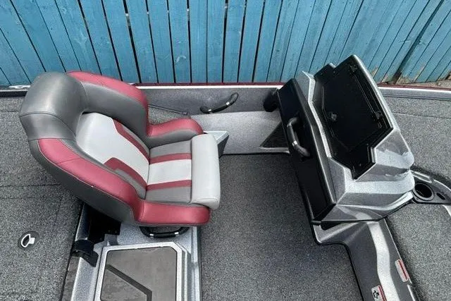 Slide: The Image of 2025 Nitro Z20 XL boat interior with red and gray seating and modern dashboard. - 20