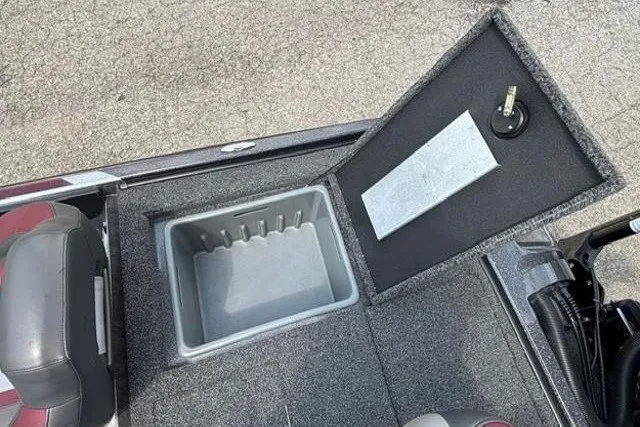 Slide: The Image of 2025 Nitro Z20 XL boat storage compartment with open lid, showcasing interior space. - 30