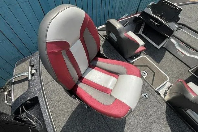 Slide: The Image of 2025 Nitro Z20 XL boat interior with red and gray seating, showcasing modern design. - 27