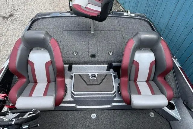 Slide: The Image of 2025 Nitro Z20 XL boat interior with red and gray seats, showcasing modern design. - 23