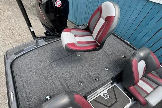 Slide: The Image of 2025 Nitro Z20 XL boat interior with red and gray seating, showcasing spacious deck design. - 26