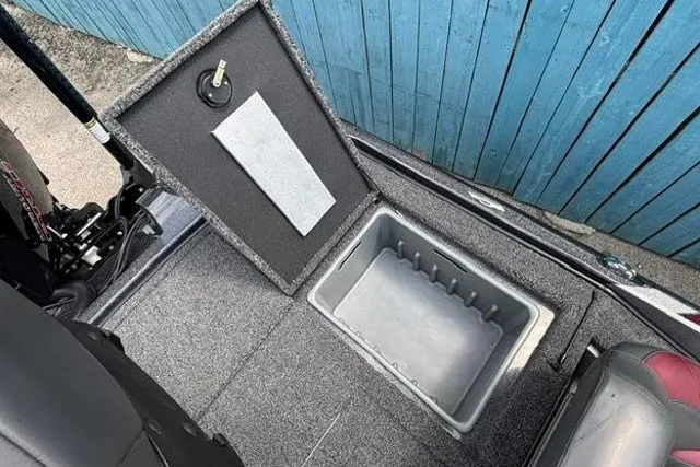 Slide: The Image of 2025 Nitro Z20 XL boat storage compartment with open lid, showcasing interior space. - 29