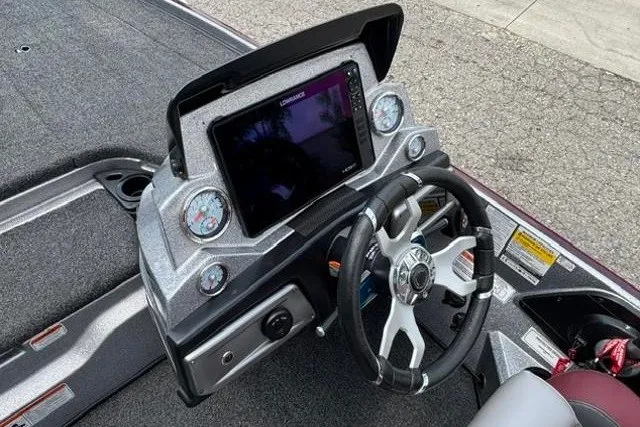 Slide: The Image of 2025 Nitro Z20 XL boat dashboard with steering wheel and digital display. - 17
