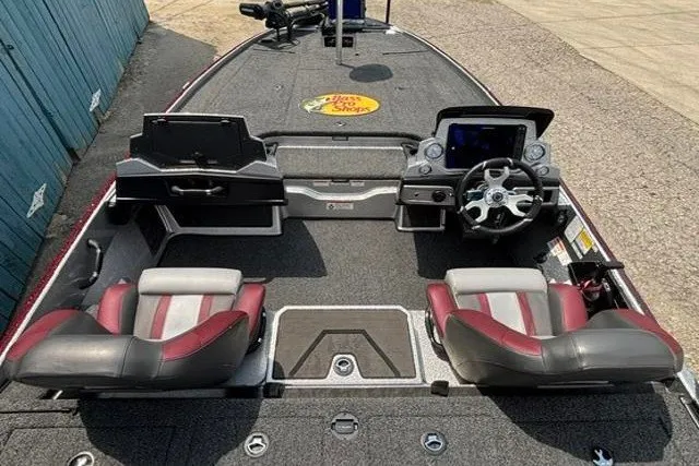 Slide: The Image of 2025 Nitro Z20 XL boat interior with dual seats, steering console, and storage compartments. - 25