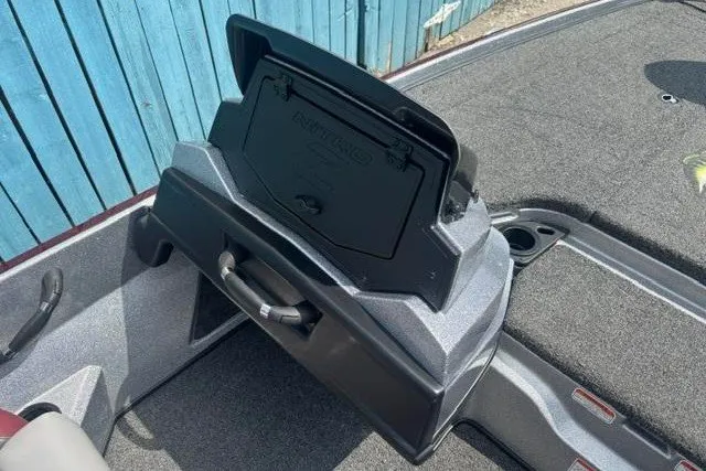 Slide: The Image of 2025 Nitro Z20 XL boat storage compartment with open lid, showcasing interior design. - 21