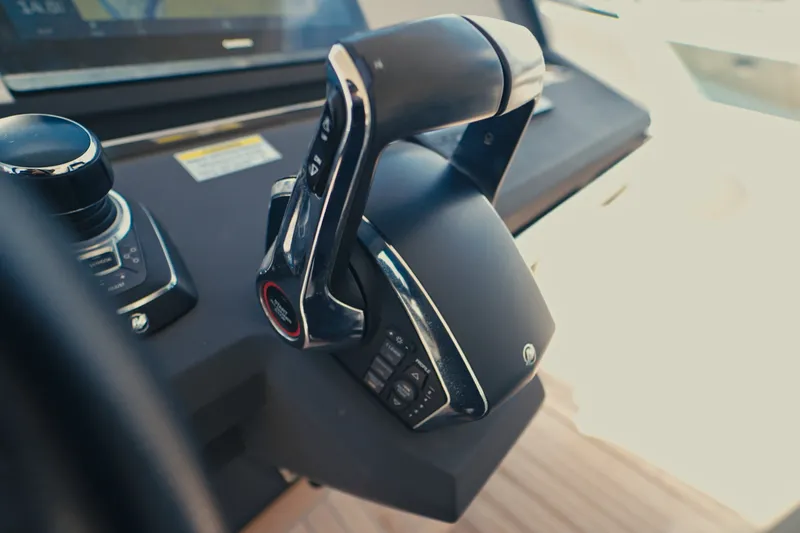 Slide: The Image of Close-up of 2022 Windy SR44 yacht throttle controls in cockpit. - 17